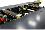 Low-profile rolling bridge jack positioned between lift runways for axle-free lifting