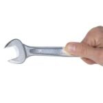 A Beta Tools 10 Combination Wrench held in hand, showing the open-end jaw and durable chrome finish built for professional performance. Get it at Wrenchers.com.