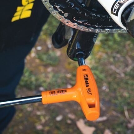 A Beta Tools 4-Offset Hexagon Key Wrench tightening a bicycle crank bolt, showing perfect leverage and comfort with its ergonomic T-handle. Get it at Wrenchers.com.