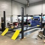 BendPak HD Series 4 post lift for garage car storage and service performance.