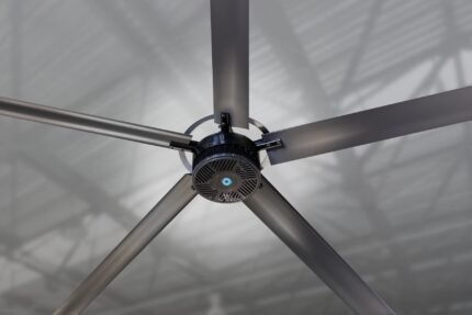 Overhead view of the Cool Boss CB-20 HVLS fan highlighting the six aluminum blades, reinforced mounting hub, and integrated safety cabling