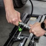 QuickJack 8000TL hydraulic quick-connect fittings allow tool-free frame connections for faster setup while maintaining secure, leak-free performance.