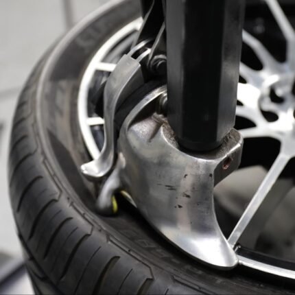 Leverless Auto Bead Lifter Kit installed on R76 tire changer, delivering fast, damage-free tire mounting for high-efficiency shop performance.